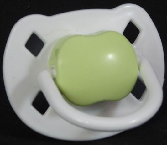 White & green Spanish style dummy with Nuk teat