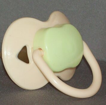 cream and green Spanish style dummy with Nuk teat