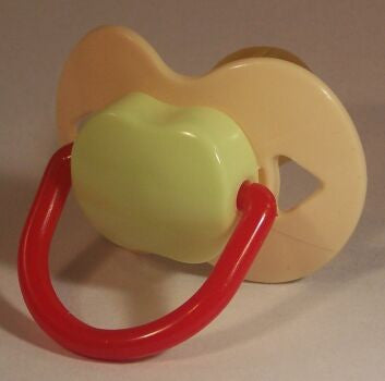 cream green and red Spanish style dummy with Nuk teat